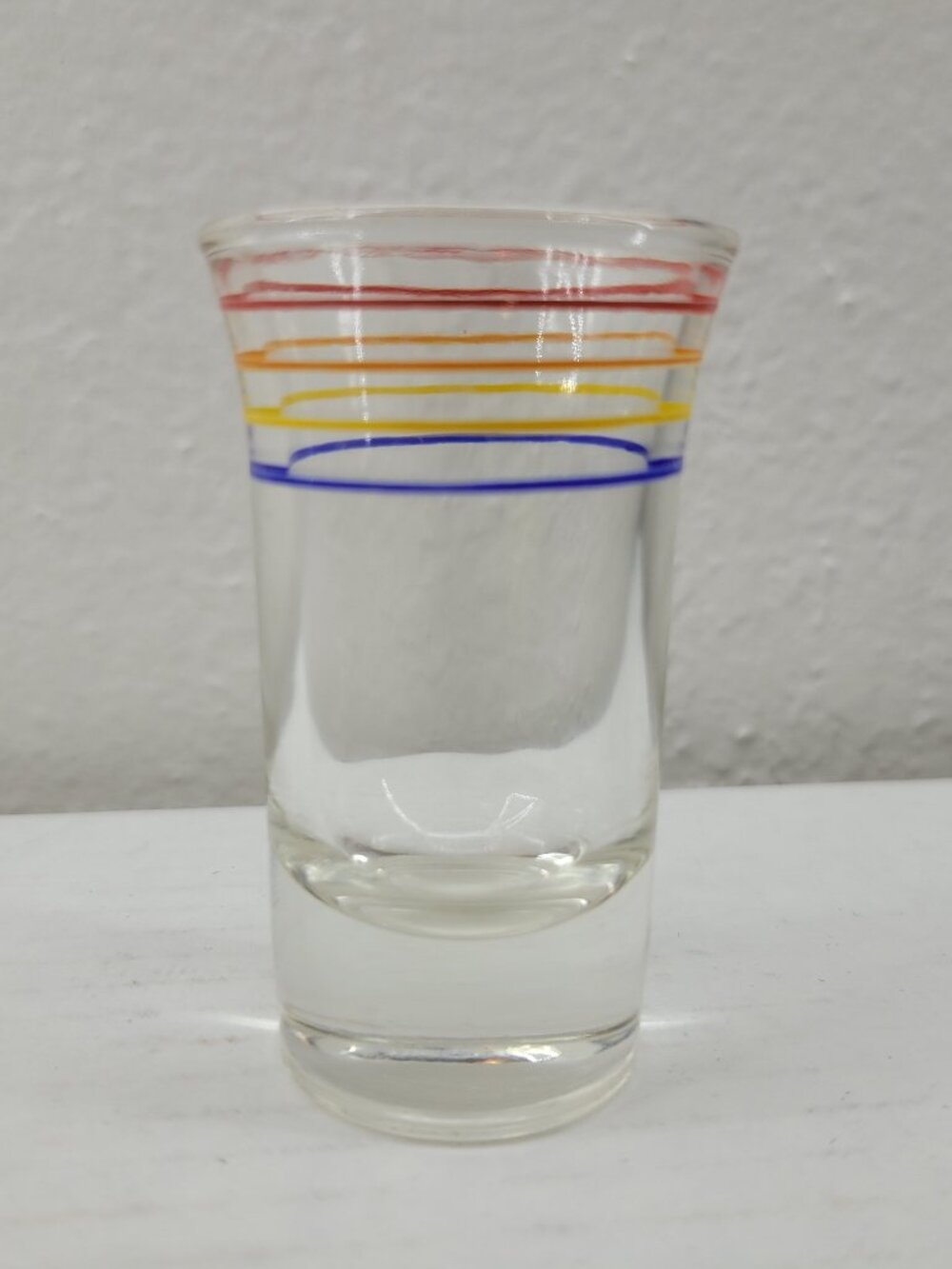 Vintage shot glass clear with orange red yellow blue stripes Mid-century Modern